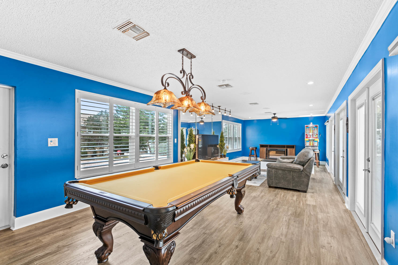 room with bright blue walls and pool table